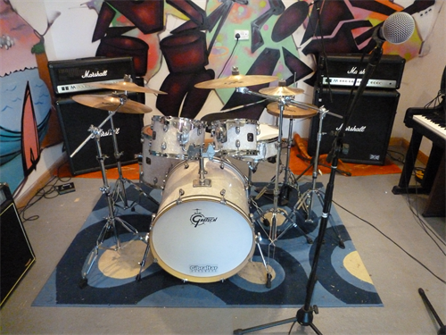 Drum and amp equipment available for use within The Base.