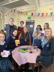 The Mayor of Seaford with pupils from Seaford Head School decorating patches for the mayor's coat.