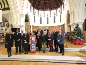 Group photo of Dignitaries at the Mayor's Carol Concert on the alter 